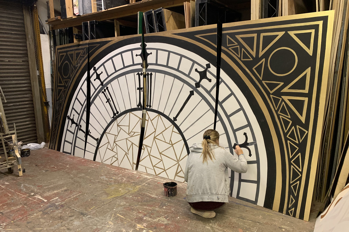 Scenic Artist painting Big Ben clockface flats